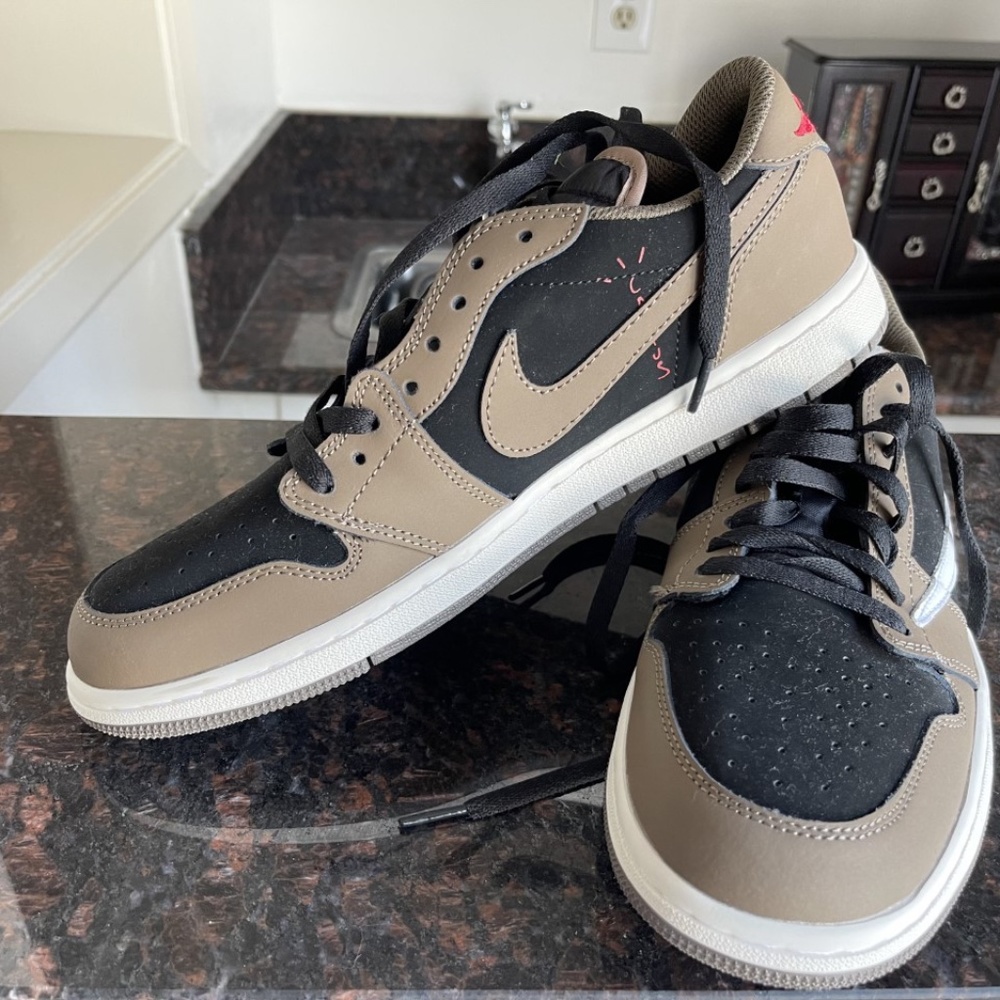 2 pairs of Travis Scott Nike Air Jordan High Tops